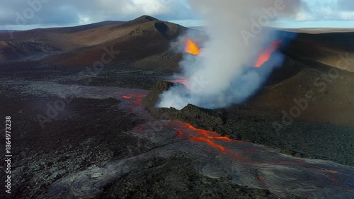 Volcanic eruption with lava flow and smoke plume.