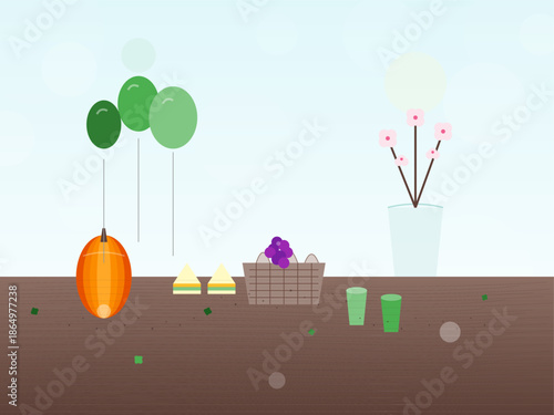 Festive gathering with balloons, snacks, and drinks on a table in a light setting