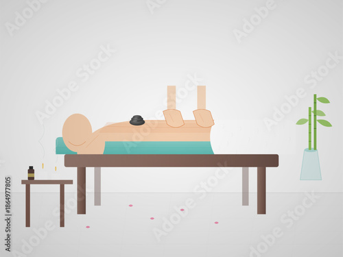 Person receives a massage while lying on a table in a simple room with a plant nearby and some items on a side table