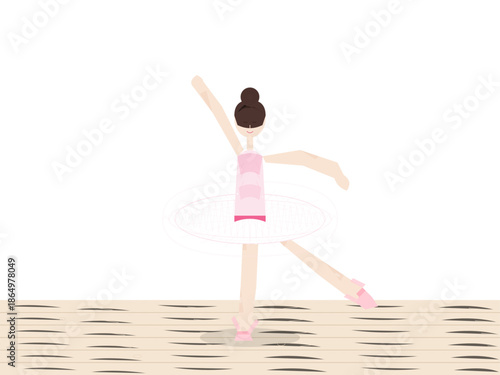 Ballet dancer performs on wooden floor in bright studio during afternoon practice session