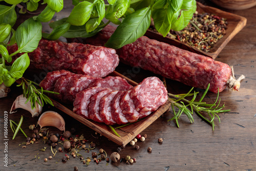 Sliced smoked sausage with herbs and spices. © Igor Normann