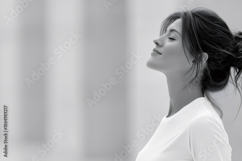 Woman finding peace and tranquility, eyes closed, enjoying a moment of mindfulness and relaxation