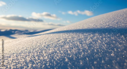 Close-up of snow texture, icy crystals glistening under sunlight, creating a cold, bright surface, showcasing winter's beauty and serenity