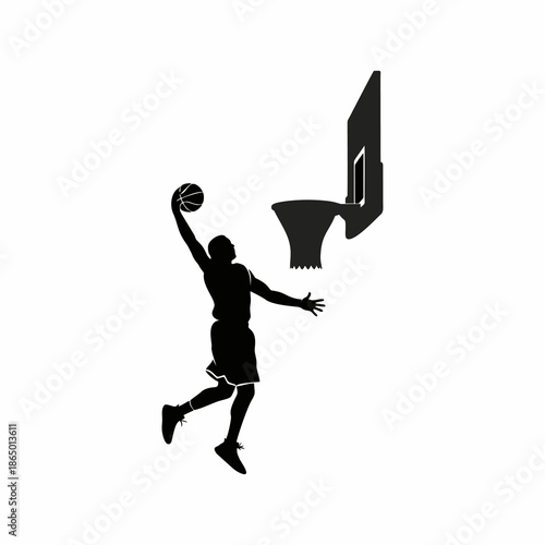 silhouette of a basketball player doing a slum dunk into the hoop