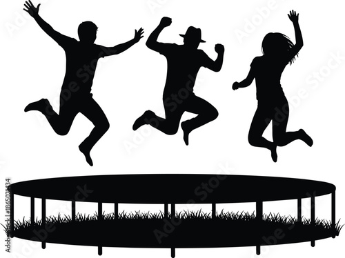 Silhouetted group of three happy friends jumping on a trampoline outdoors in a grassy field during summer for fun and freedom