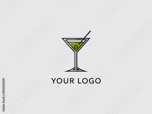 Cocktail Glass with Olive and Stirrer.