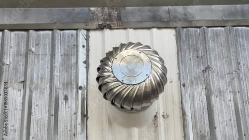 Turbine roof ventilator spinning.