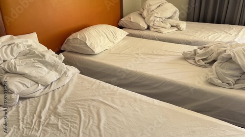 Triple bedroom at hotel after checked out. 