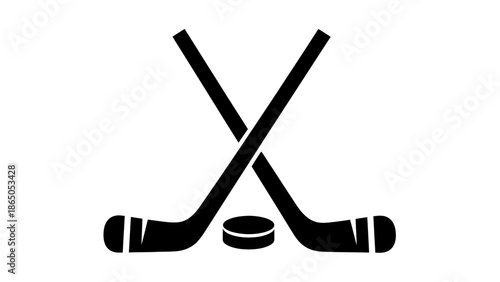 Crossed ice hockey sticks with puck, equipment for winter sport, isolated white background.