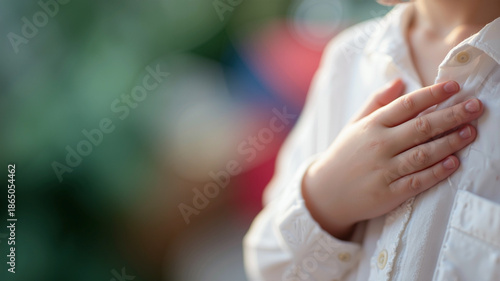 Wallpaper Mural Solemn pledge of allegiance with child's hand on heart in a sunlit classroom Torontodigital.ca