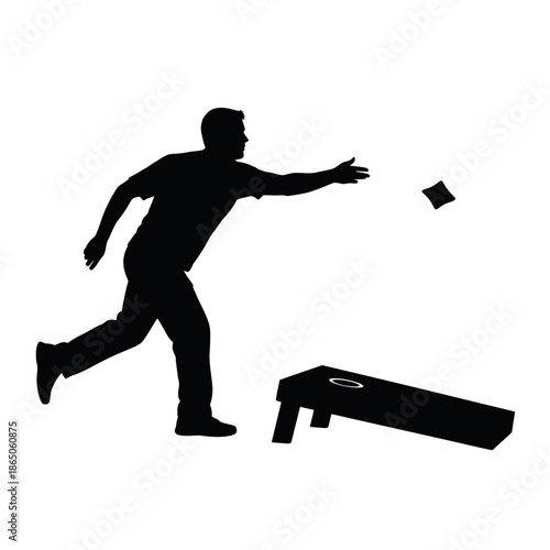 Silhouette of a man throwing a beanbag towards a cornhole board.