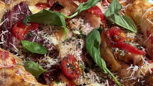 A fluffy Neapolitan pizza with porchetta. Delicious pizza, tomatoes, cheese, a taste of southern Italy.