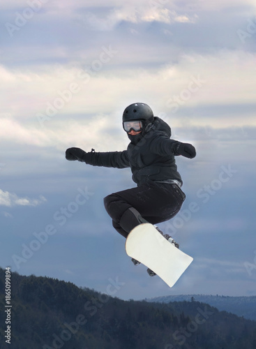 child snowbording during winter in quebec canada