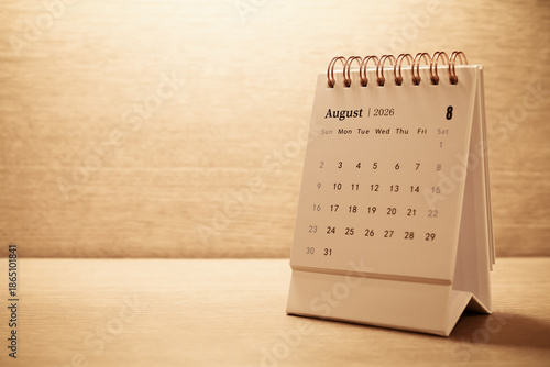 Calendar page of August 2026 on desk, with copy space. monthly planning concept, important schedules, meetings, and appointments.