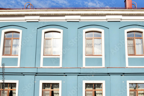 Part of a building with blue windows in Scandinavian style