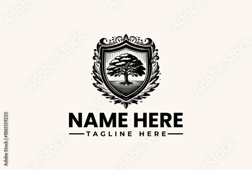 Free Download A black and white logo featuring a tree within a shield surrounded by ornate designs on a beige background with placeholder text for a name and tagline. - GFXLoad