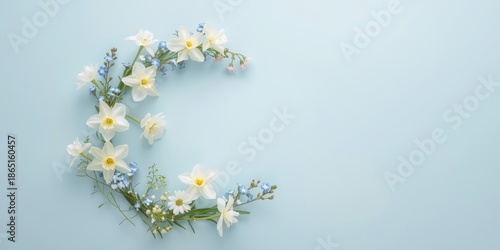 Serene Floral Arrangement of White Daffodils and Baby's Breath on Soft Blue Background, Perfect for Spring