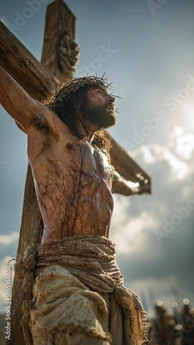 Jesus nailed to the cross in a painful religious Calvary. Vertical video