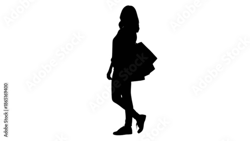 Silhouette of a woman carrying shopping bags, walking casually after a successful retail therapy session