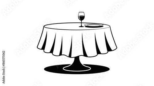 Elegant round dining table with a flowing tablecloth, set for a sophisticated meal