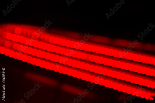 8K red abstract lights. Generic graphic design resource. Diagonal red blurry lights. 