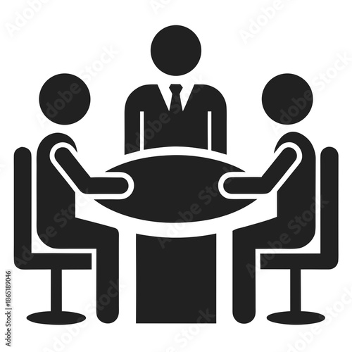 Title: Three people sitting around a table with one person in a suit and tie in the middle with a