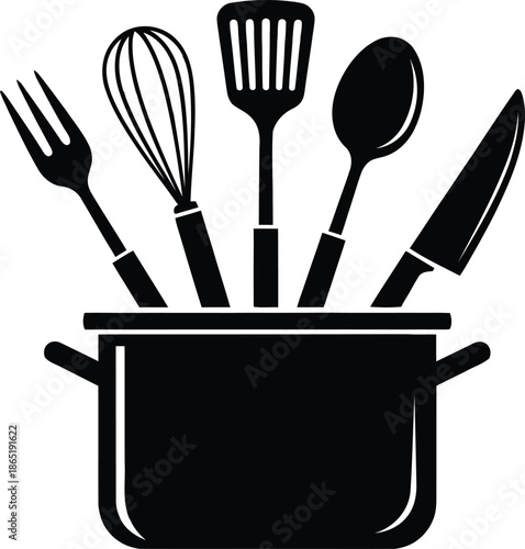 Kitchen utensils in a pot illustrating cooking preparation and culinary tools