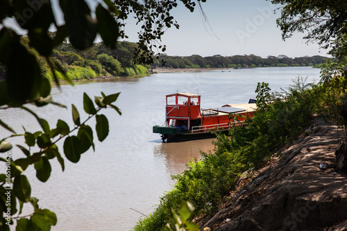 Wallpaper Mural Non motorized ferry, called planchon, used by residents to cross the Sinu River from one bank to the other in the city of Monteria, Colombia. Torontodigital.ca