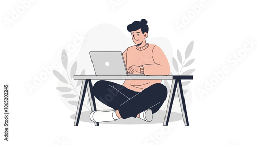 Young Man Working on Laptop Computer While Sitting Cross-legged on Floor