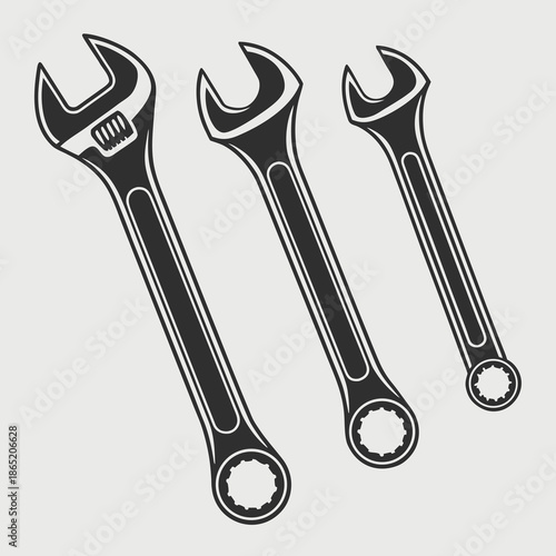a graphic depiction of three adjustable wrenches arranged diagonally showcasing a bold and striking silhouette