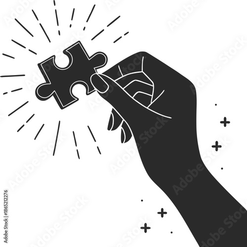 Hand holding puzzle piece with inspiration and innovation