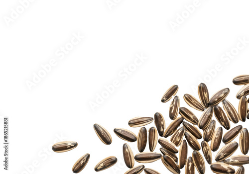 Roasted sunflower seeds with distinct black and white striped husks, scattered on a transparent background with ample copy space, top-down view. Healthy snacking concept
