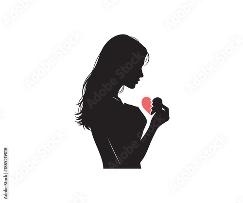 Silhouette of a woman holding broken heart shapes in her hands