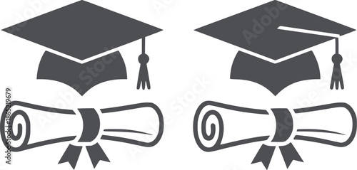 Four black graduation caps and diplomas in clean