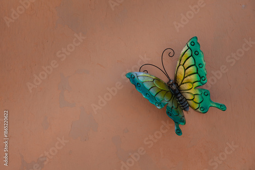 Wallpaper Mural Beautiful handcrafted butterfly on a peach color wall. Torontodigital.ca