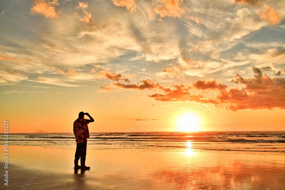 Fototapeta premium Foxton Beach New Zealand Sunset High Tide Man Watching Sunset