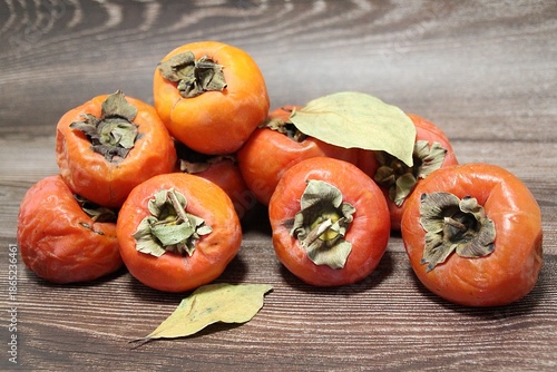 persimmons, orange sharons, autumn fruits, persimmons in a wooden box, ripe fruits

