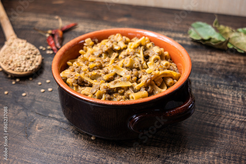 Pasta and lentils served on a ceramic bowl. Mediterranean food naturally vegan.