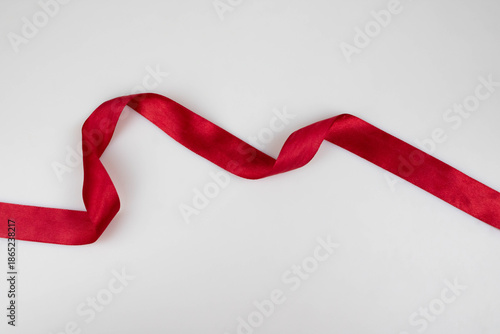 Red satin narrow ribbon for wrapping gifts