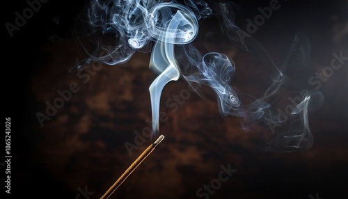 smoke rising from incense stick against a dark background