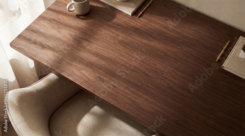 Cozy workspace: a minimalistic wooden desk in a neutral-toned office setting with a chair and decor.