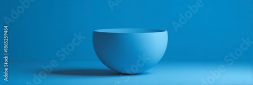Minimalist Blue Bowl on Calm Blue Background
