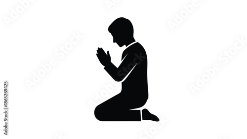 A silhouette of a man kneeling in a posture of prayer and reverence