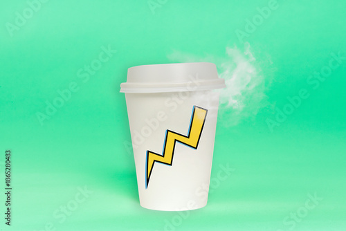 Disposable coffee cup with steam coming from hot drink isolated on plain background