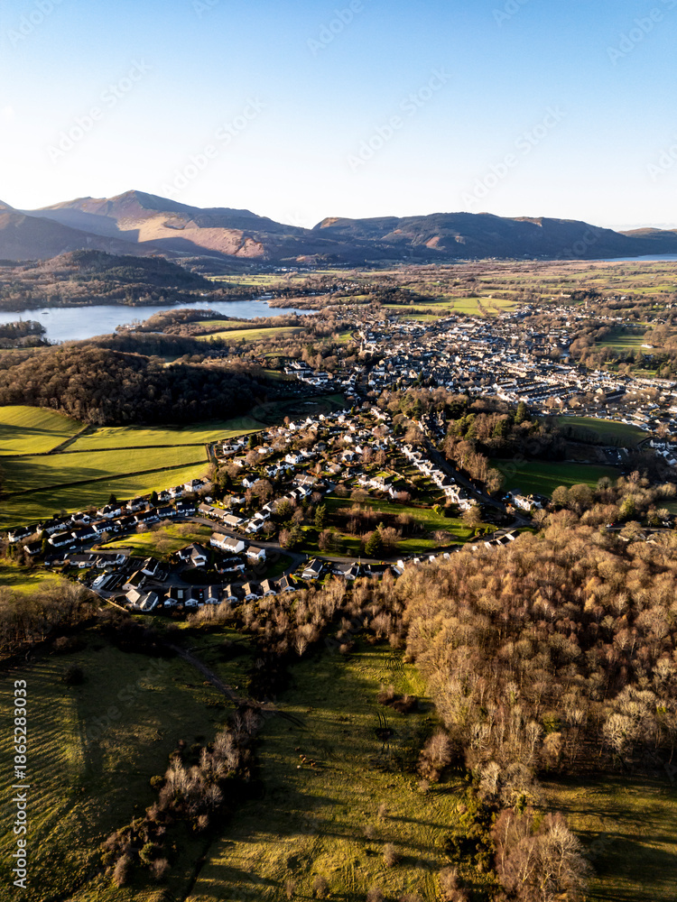 Fototapeta premium Aerial of small mountain town at sunset - Keswick, Cumbria