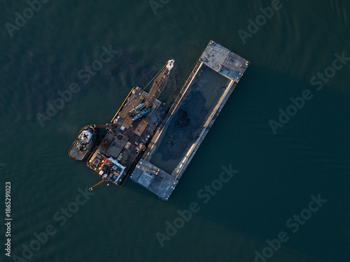 Overhead view of dredger in the river