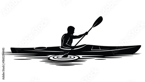 Silhouette of a kayaker paddling a boat on rippling water