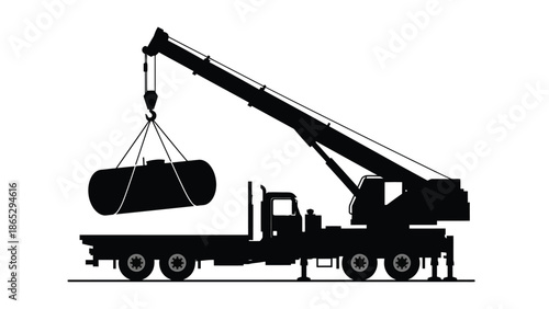 Silhouette of a mobile crane lifting heavy cylindrical containers