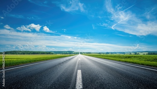 Freshly laid asphalt surface with open sky, road repair ensuring longevity and compliance