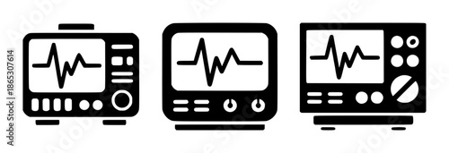 Black silhouette of medical monitors displaying electrocardiogram waveforms heart